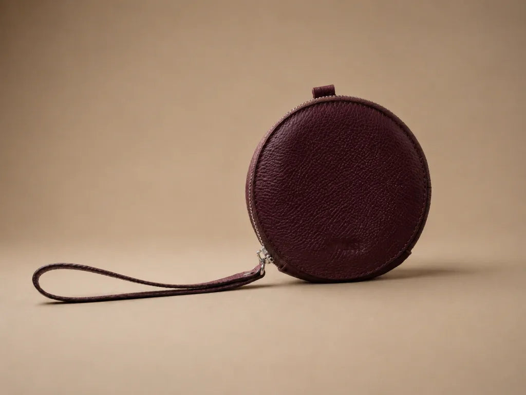 AURA-MINI POUCH EN CUERO VINO