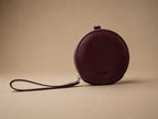 AURA-MINI POUCH EN CUERO VINO